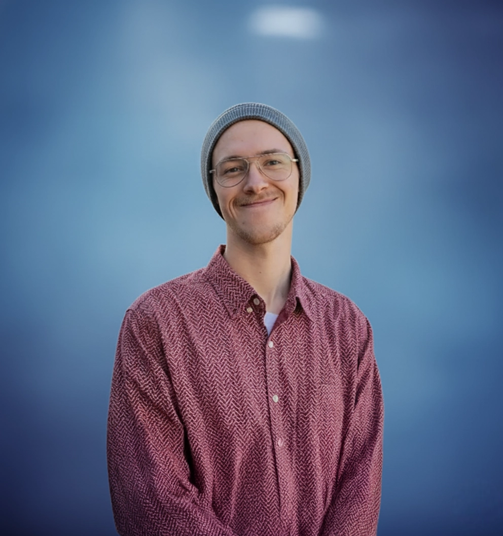 Bryan Westphal Headshot in a blue background