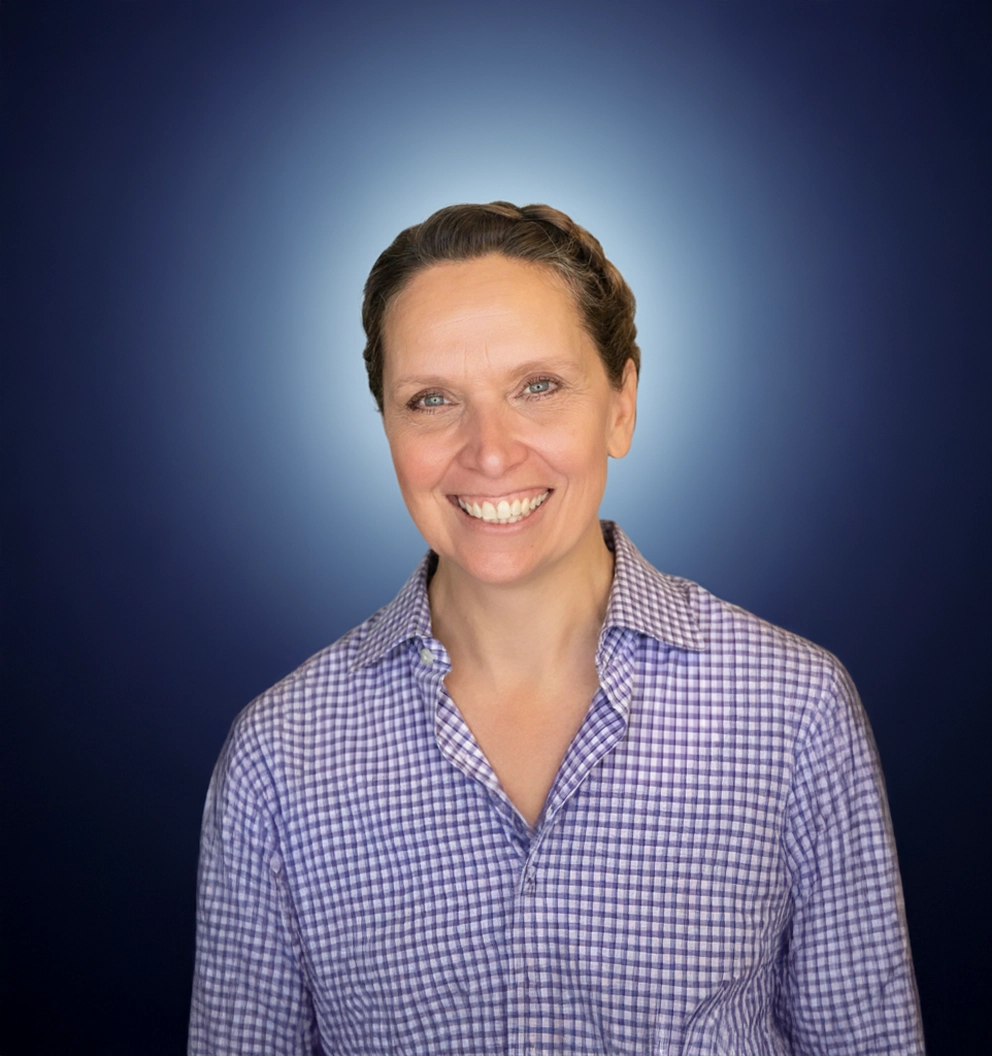 Team Member Dodie on a photo studio blue background