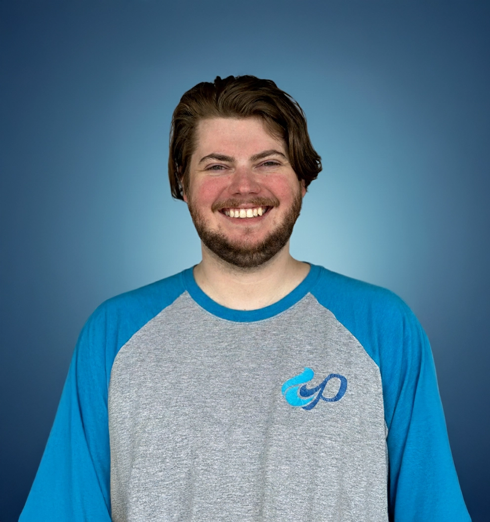 Team Member Eben on a photo studio blue background