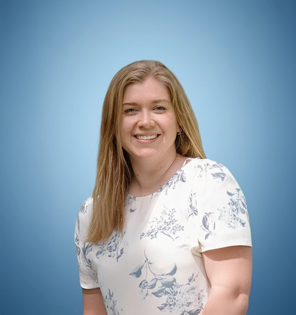 Team Member Elisabeth Justice on a photo studio blue background