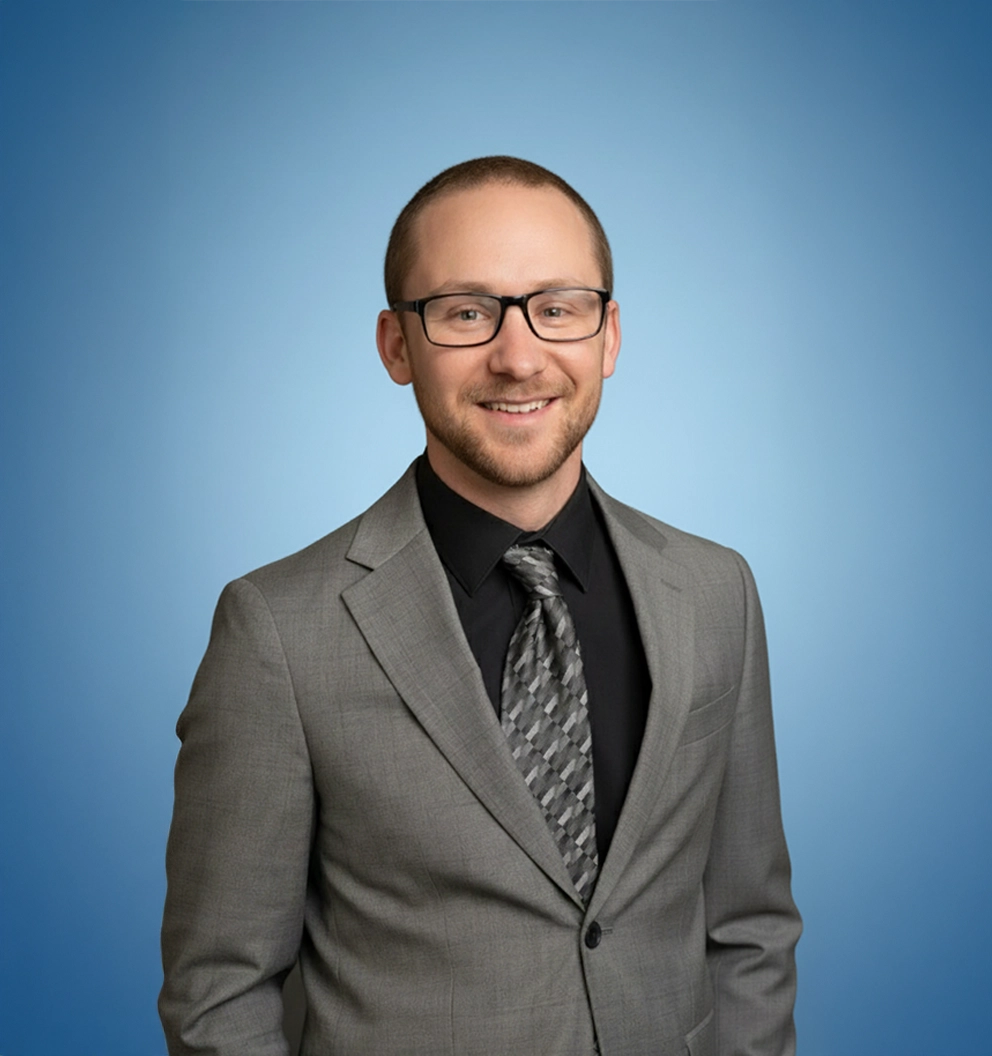 Team Member Jake on a photo studio blue background