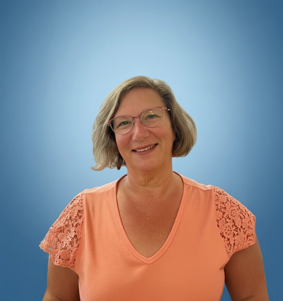 Team Member Janet on a photo studio blue background