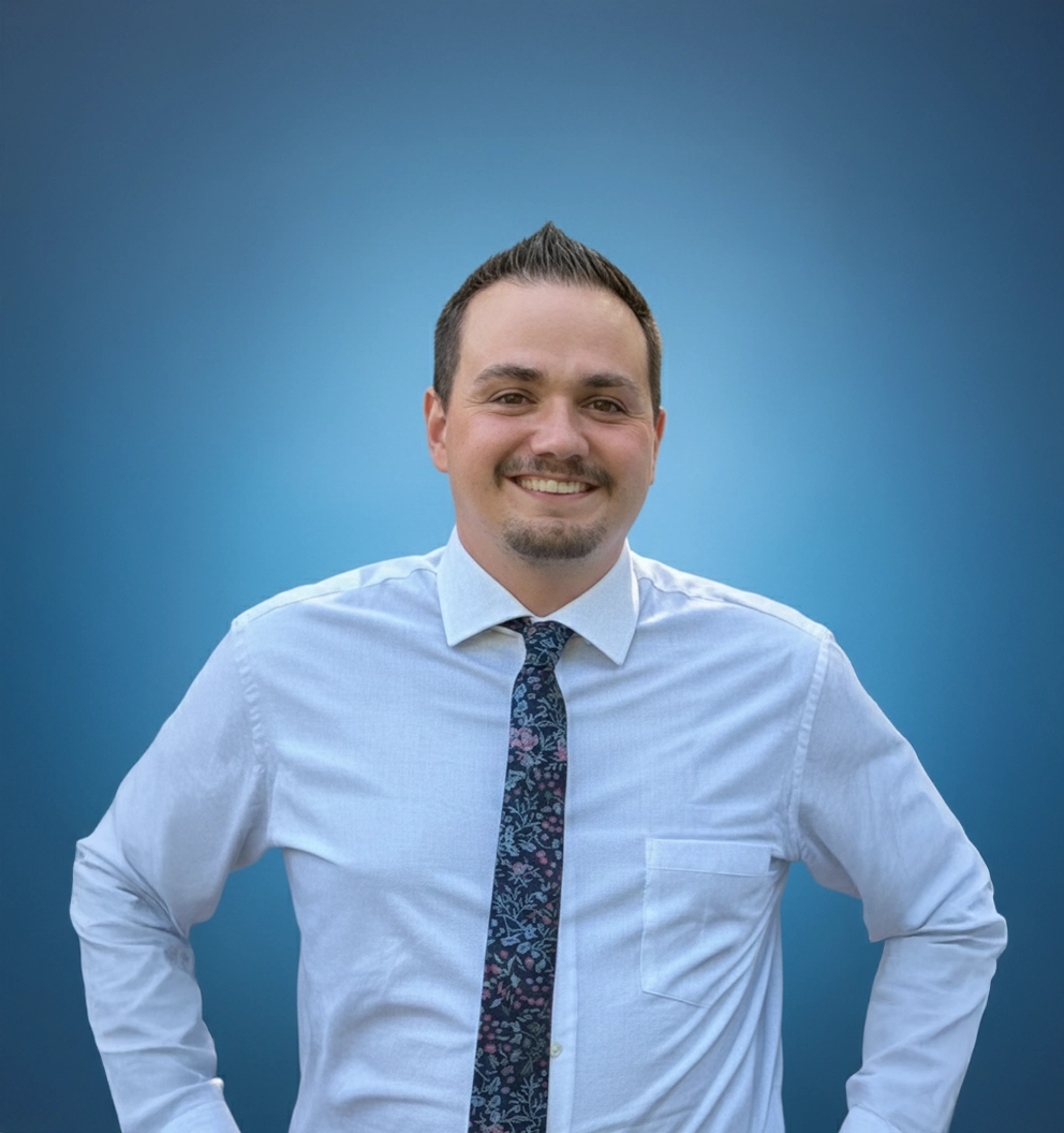 Team Member Jarod on a photo studio blue background