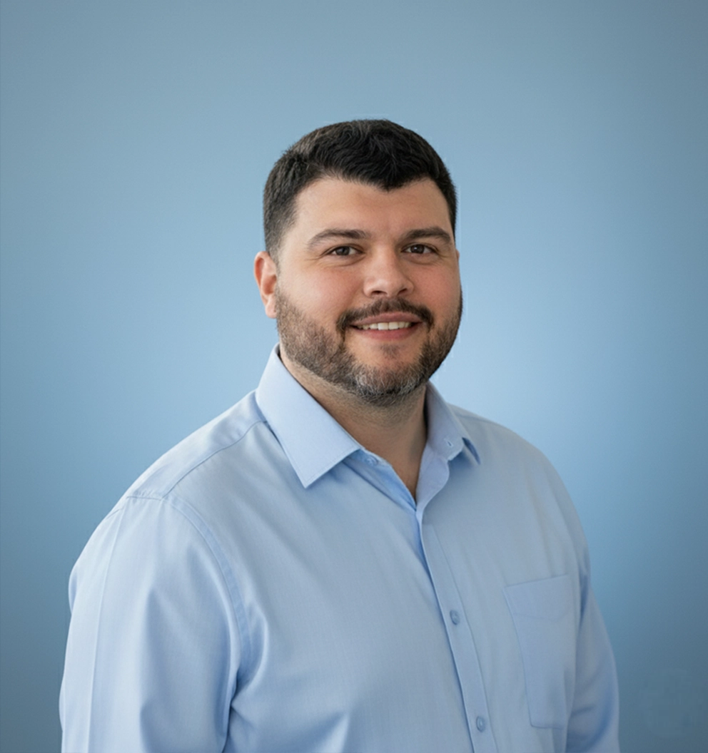 Team Member Jon on a photo studio blue background