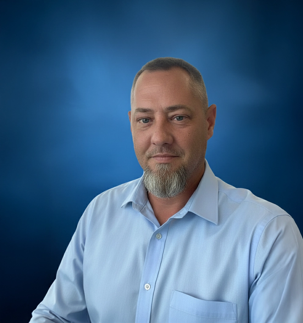 Team Member Josh on a photo studio blue background