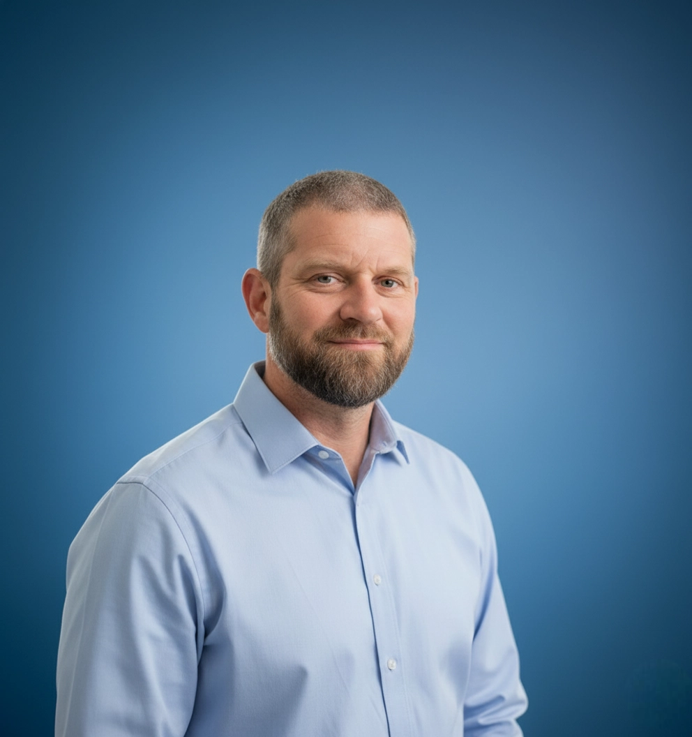 Team Member Joshua on a photo studio blue background