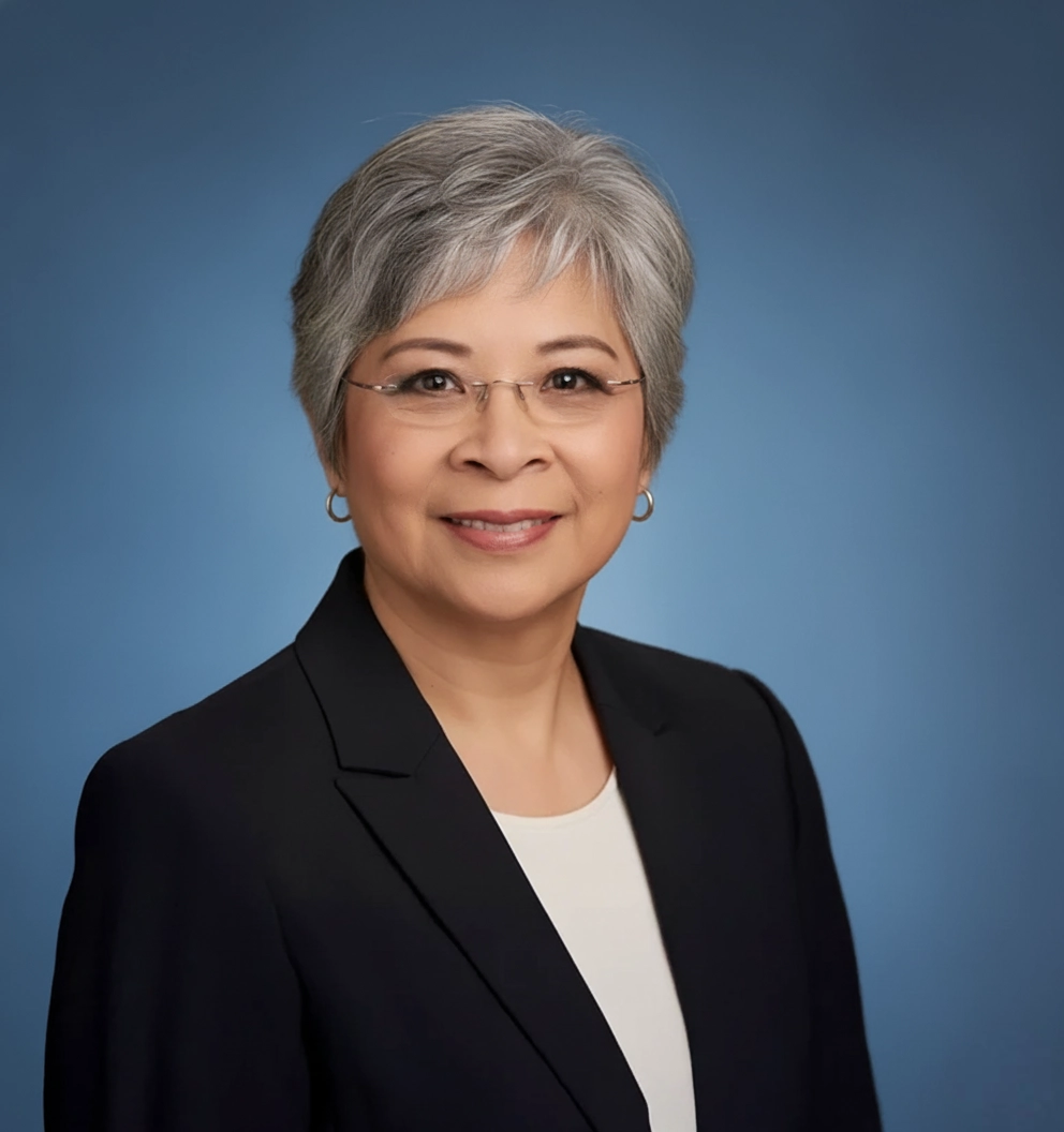 Team Member Linda on a photo studio blue background