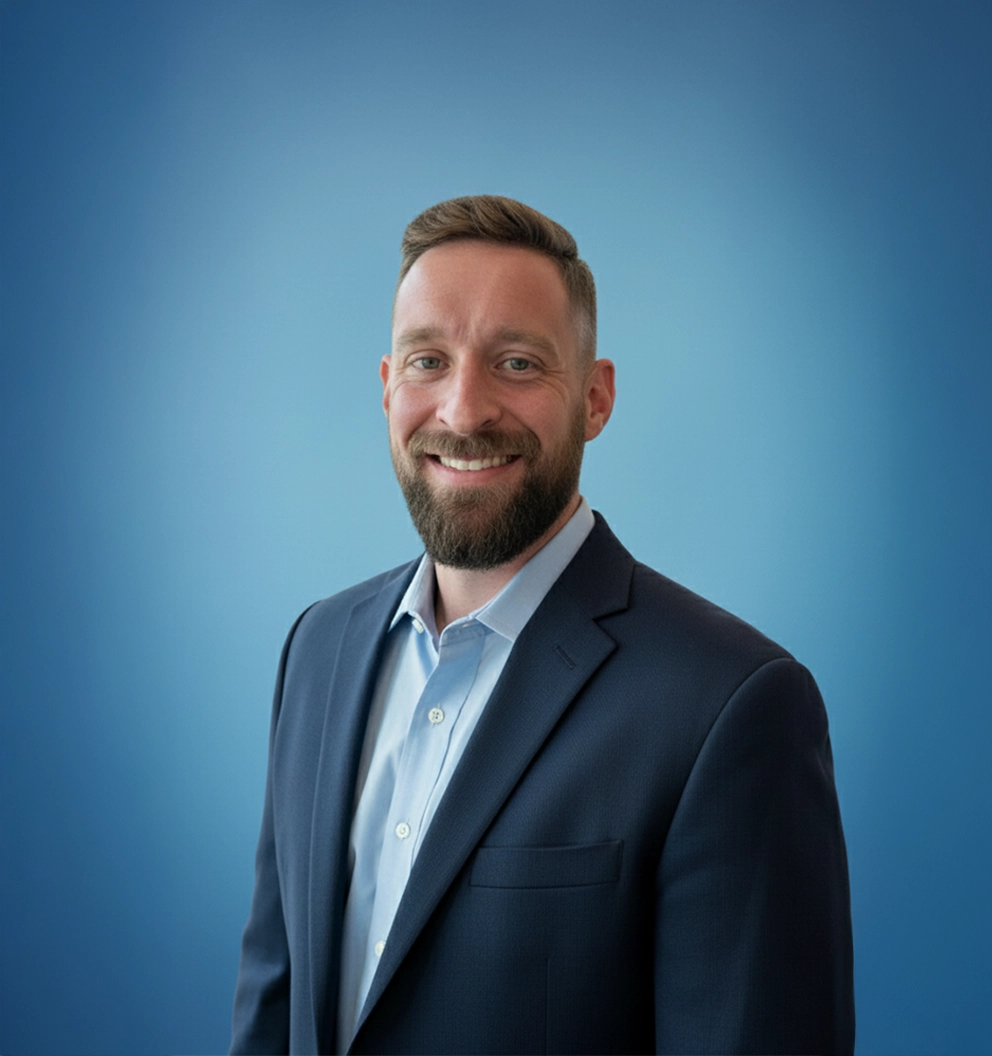 Team Member Matthew on a photo studio blue background