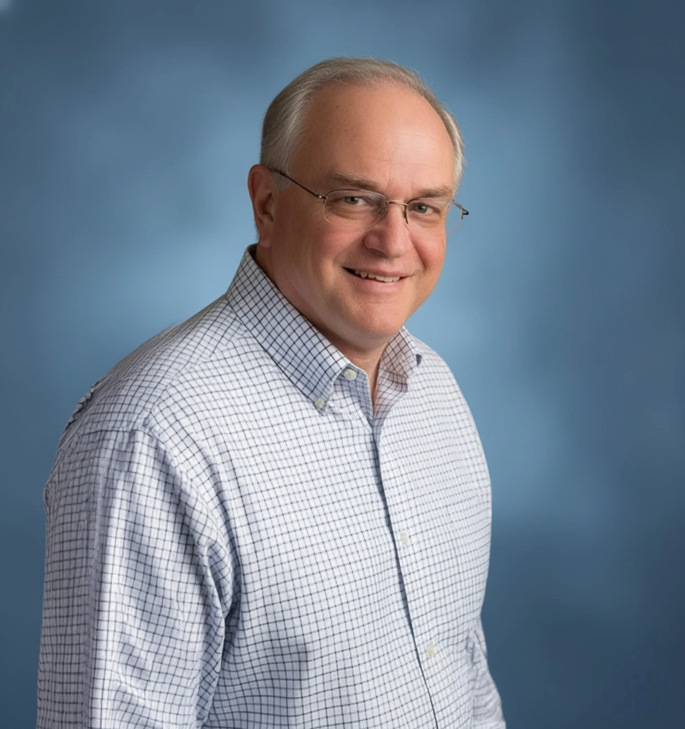 Team Member Mike on a photo studio blue background