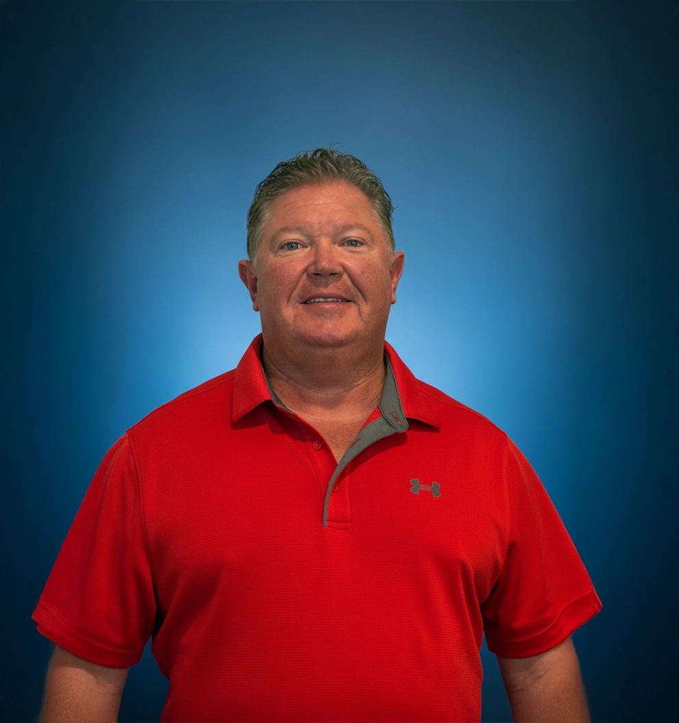 Pools of Fun Owner Tim Colon on a photo studio blue background